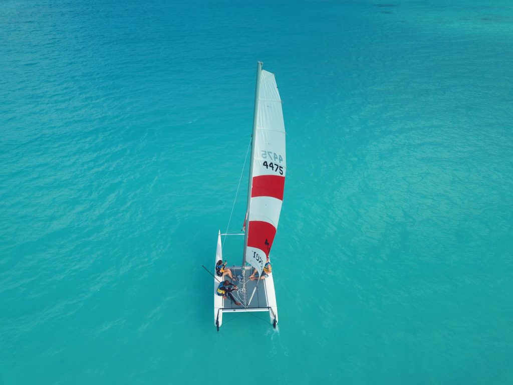 MALDIVES : 25 February 2020, A Catamaran Sailing on the clear lagoon